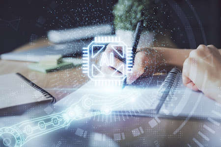 Double exposure of hands making notes background with technology and digital coding huds. Data...