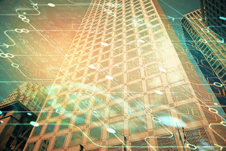 Data theme hologram drawing on city view with skyscrapers background multi exposure. Bigdata...