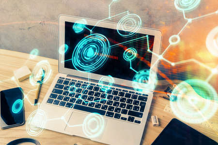 Computer on desktop with social network hologram. Multi exposure. Concept of international people...
