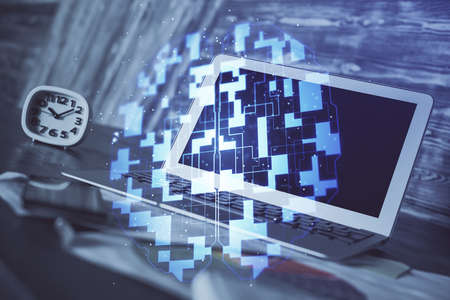 Double exposure of laptop computer and technology theme hologram. Concept of freelance work.