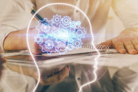 Mans hands with atificial intelligence double exposure icon. Concept of computer learning.