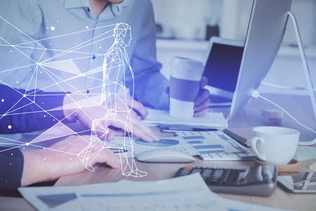 Start up drawings with businessman working on computer on background. Teamwork concept. Double...