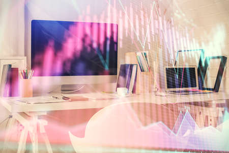 Double exposure of financial graph drawing and office interior background. Concept of stock market.の写真素材