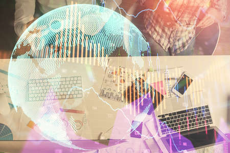 Double exposure of man and woman working together and financial chart hologram drawing. market...