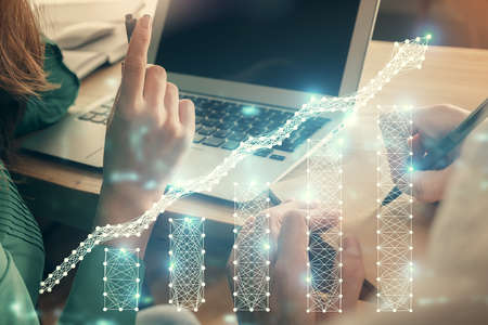 Double exposure of man and woman working together and forex chart hologram. Business concept....