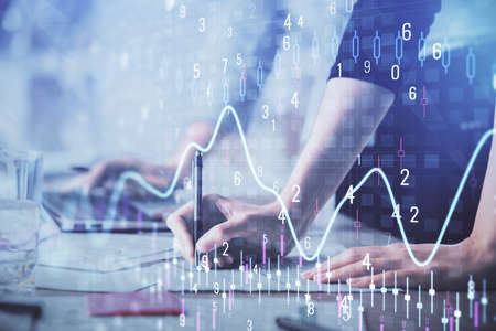 Multi exposure of woman hands typing on computer and financial chart hologram drawing. Stock market...