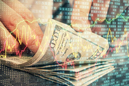 Multi exposure of forex graph drawing hologram and USA dollars bills and man hands. Technical Analysis concept.の写真素材