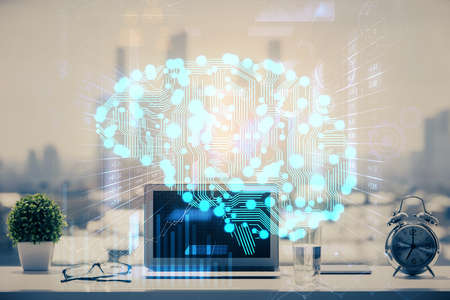 Double exposure of desktop with computer and brain drawing hologram. Artificial intelligence...