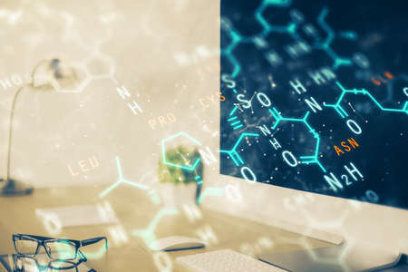 Desktop computer background and formula hologram writing. Double exposure. Education concept.の写真素材