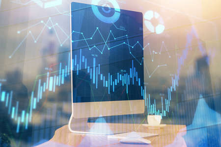 Financial market graph hologram and personal computer on background. Multi exposure. Concept of...