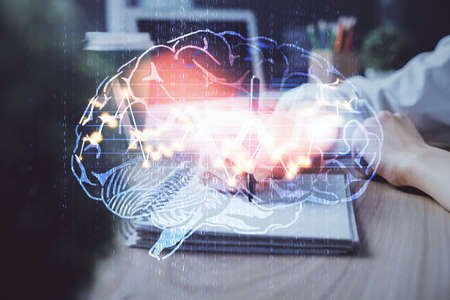 Multi exposure of writing hand on background with brain hologram. Concept of learning.の写真素材
