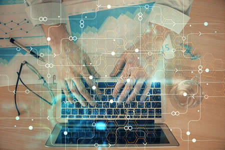Businessman with computer background with technology theme hologram. Concept of big data. Double...