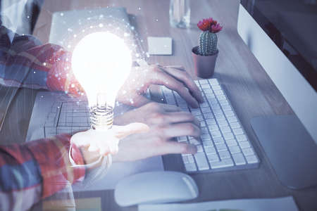 Growing arrows with businessman working on computer on background. Success concept. Double exposure.の写真素材