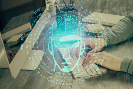 Man with computer background with brain theme hologram. Concept of brainstorm. Double exposure.
