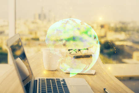 Computer on desktop with social network hologram. Multi exposure. Concept of international people...