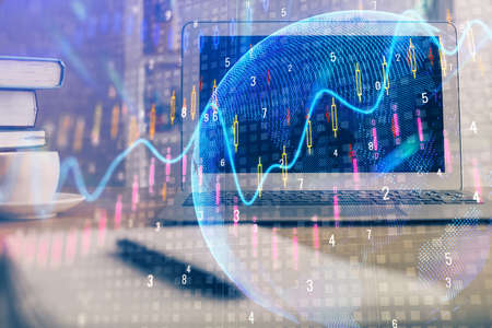 Multi exposure of graph and financial info and work space with computer background. Concept of...