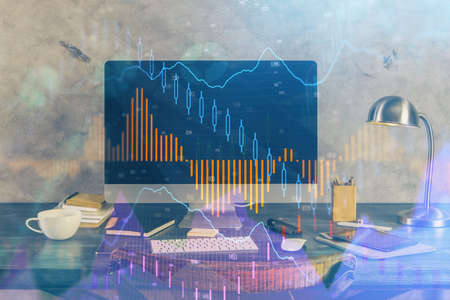 Double exposure of graph and financial info and work space with computer background. Concept of...