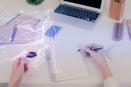 Start up creative drawing over close up hands in notepad background. Concept of brainstorming....