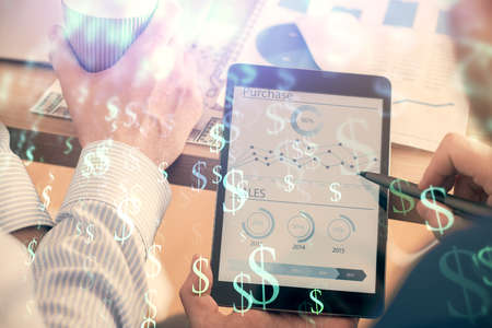 Double exposure of mans hands holding and using a phone and financial chart drawing. Market analysis concept.の写真素材