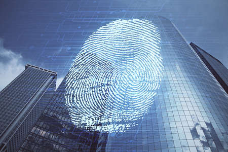 Double exposure of finger print hologram and cityscape background. Concept of personal security.