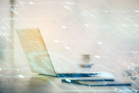 Double exposure of table with computer on background and data theme drawing. Concept of innovation.