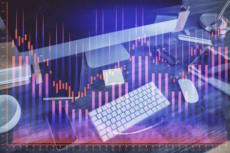 Multi exposure of graph and financial info and work space with computer background. Concept of...
