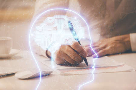 Mans hands withbrain double exposure drawing. Concept of human learning.の写真素材