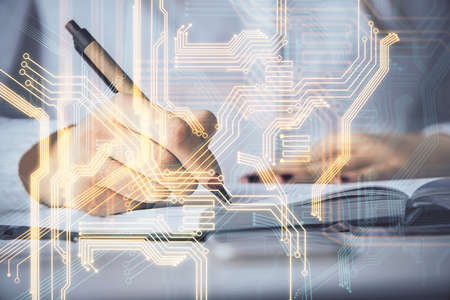 Technology theme hologram over womans hands taking notes background. Concept of Tech. Double...
