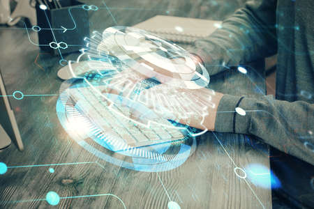 A man working on computer with technology theme drawing. Concept of big data. Multi exposure.