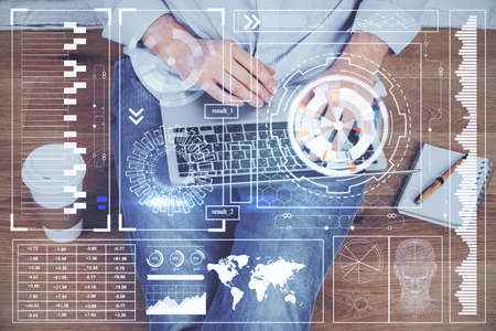 Multi exposure of technology hologram with man working on computer background. Concept of big data.