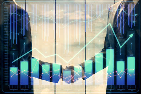 Double exposure of forex graph hologram and handshake of two men. Stock market concept.