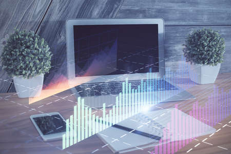 Financial market graph hologram and personal computer on background. Multi exposure. Concept of...