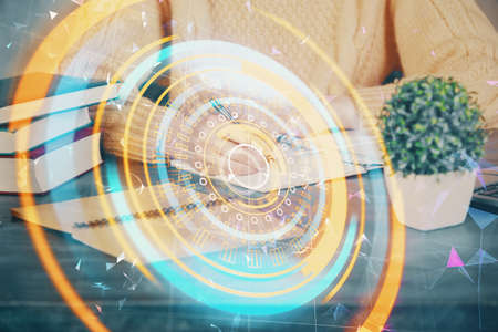 Tech theme hologram over womans hands taking notes background. Concept of hightech. Double exposure