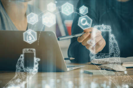 Technology theme hologram with man working on computer on background. High tech concept. Multi exposure.の写真素材
