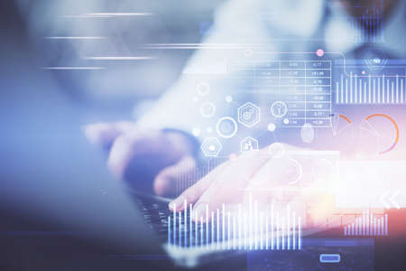 Multi exposure of data internet theme hologram with man working on computer on background. Concept...