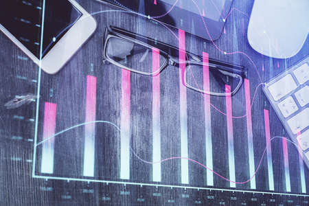 Multi exposure of forex graph hologram over desktop with phone. Top view. Mobile trade platform concept.の写真素材