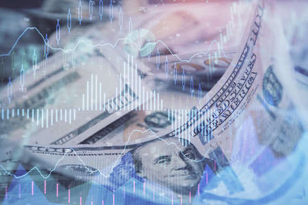 Double exposure of forex graph drawing over us dollars bill background. Concept of financial markets.の写真素材