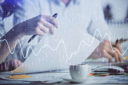 Double exposure of forex graph drawing over people taking notes background. Concept of financial...