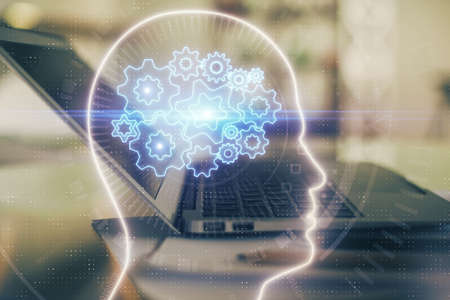 Double exposure of desktop with computer and brain drawing hologram. Artificial intelligence...