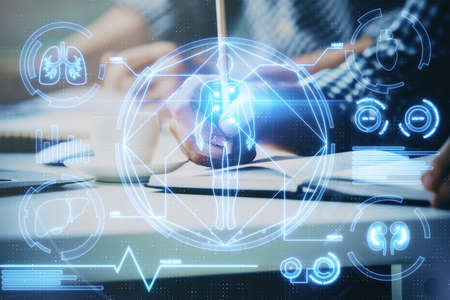 Mans hands working with notes background. Modern computer record diagram with virtual mnitor....