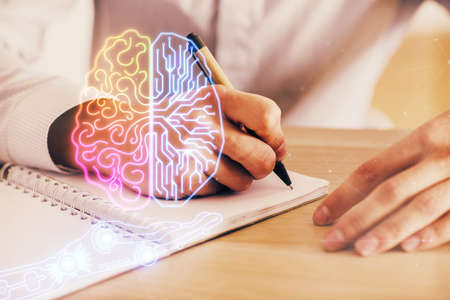 Mans hands with atificial intelligence double exposure icon. Concept of computer learning.の写真素材