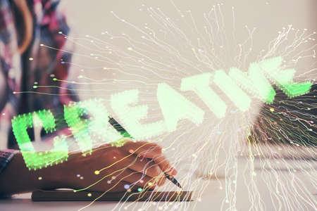 Start up creative drawing over close up hands in notepad background. Concept of brainstorming....