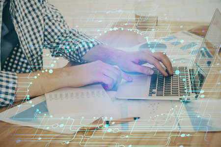 Businessman working on Laptop with technology theme drawing. Concept of big data. Double exposure.
