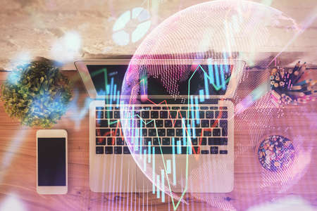 Multi exposure of financial chart drawing over table background with computer. Concept of research. Top view.の写真素材