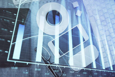 Multi exposure of forex graph hologram over desktop with phone. Top view. Mobile trade platform concept.の写真素材