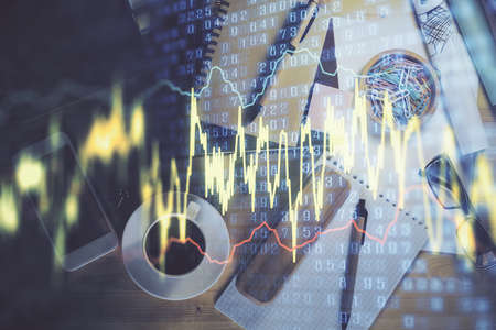Double exposure of forex graph drawing and work table top veiw. Concept of financial analysis.