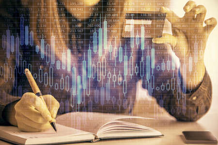 Multi exposure of woman on-line shopping holding a credit card and financial graph drawing. Stock...