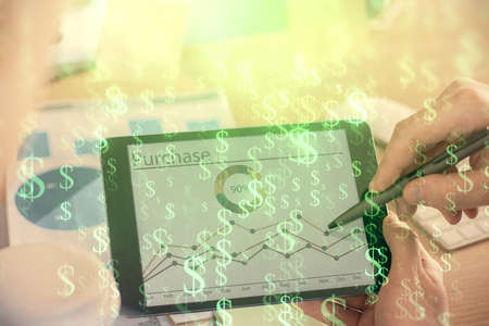 Double exposure of mans hands holding and using a phone and financial chart drawing. Market analysis concept.の写真素材