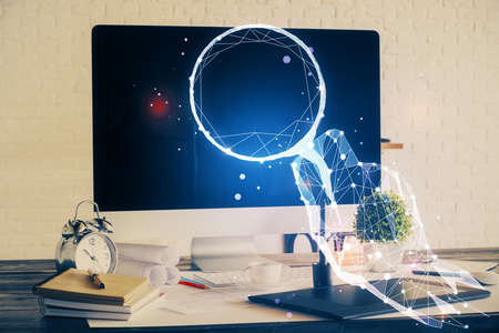 Desktop computer background in office and start up theme hologram drawing. Double exposure. Startup...