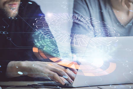 Multi exposure of data internet theme hologram with man working on computer on background. Concept...